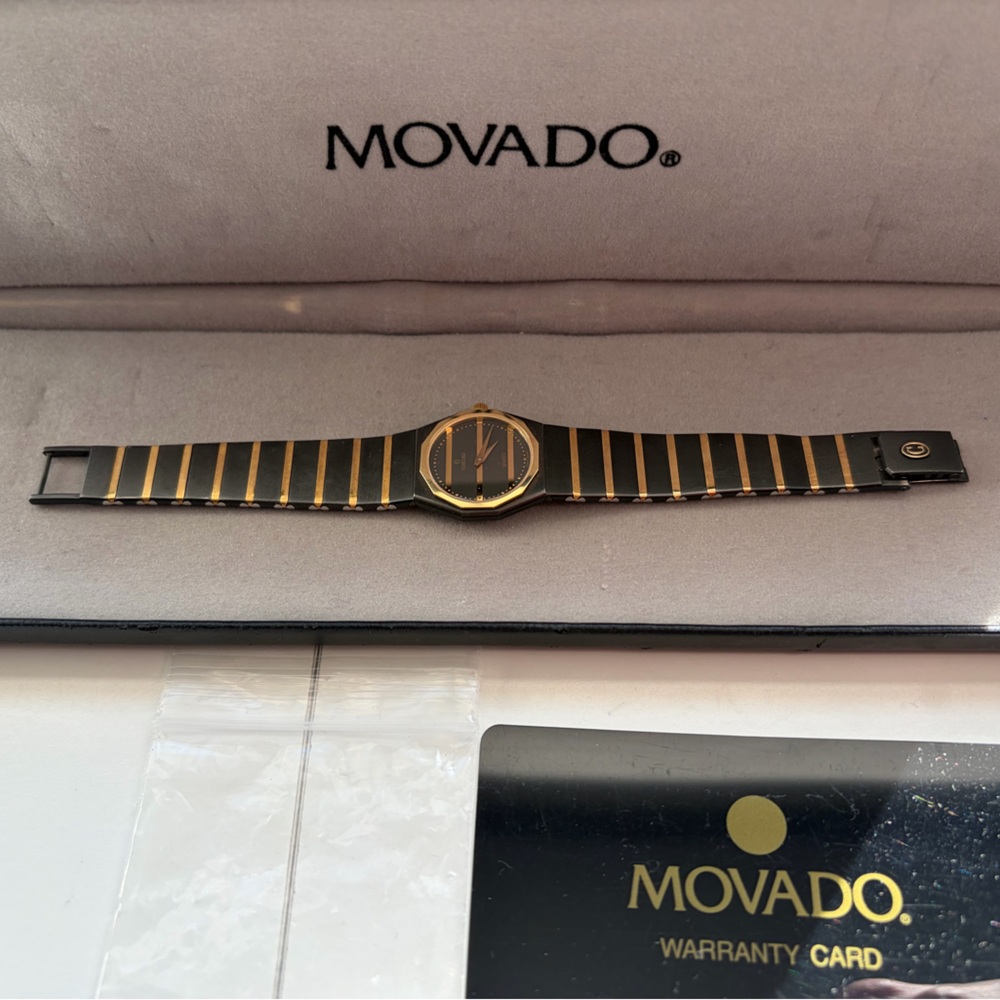 Movado Black and Gold Timepiece